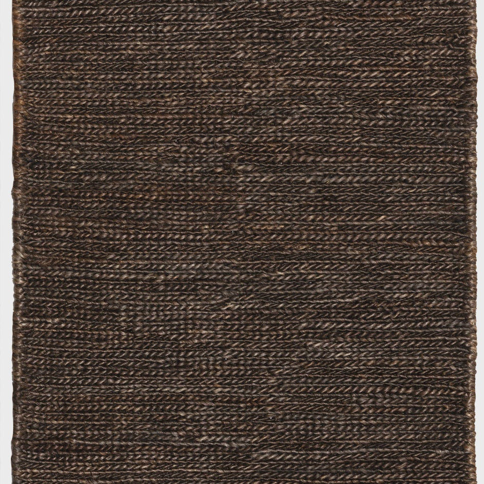 Brown woven rug with a textured pattern