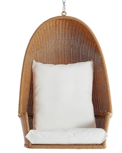 Wicker hanging chair with a white cushion on a white background