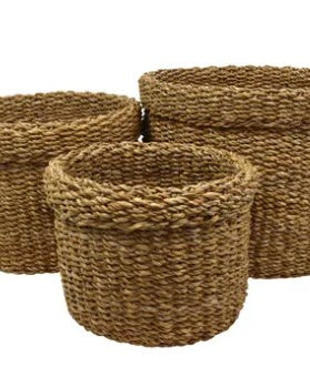 Three woven jute baskets of different sizes on a white background