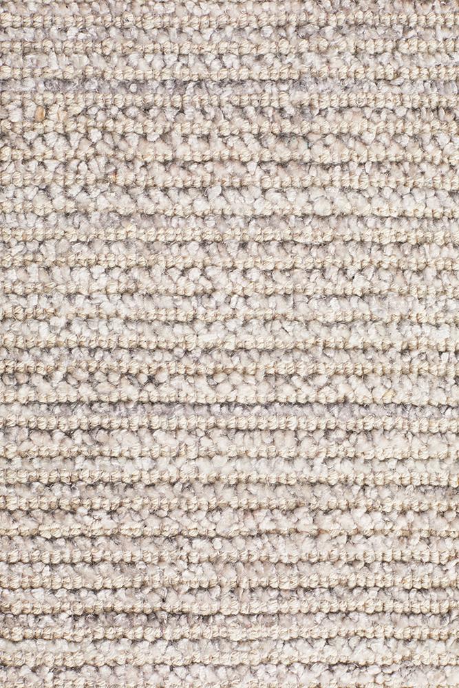 Focused image showing the precision of the Allure Rug's edge in Stone colour, highlighting the craftsmanship of its hand-loomed construction.