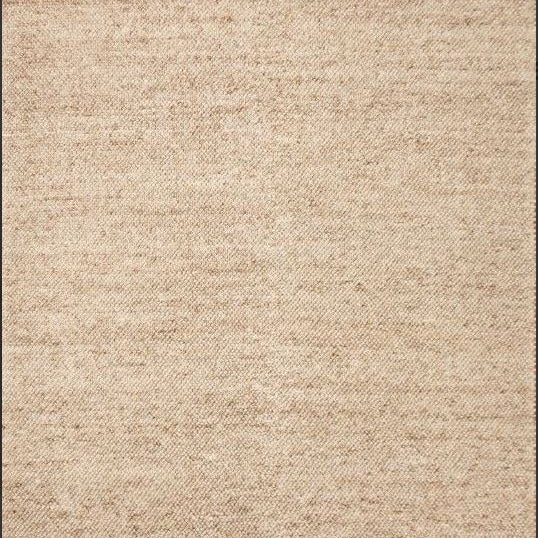 Beige textured rug with a subtle pattern