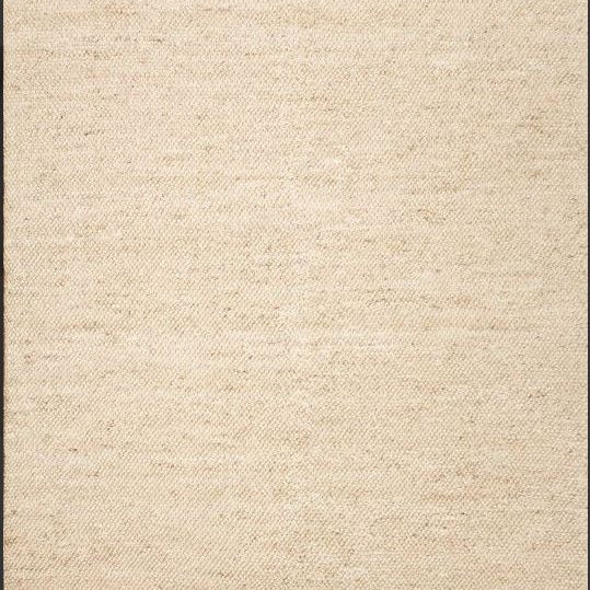 Beige textured rug with a subtle pattern