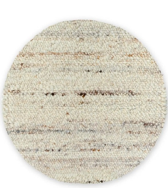 A round Belgium wool rug with a textured looped and sheared design in mushroom color.
