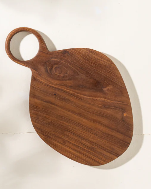 Wooden cutting board with a handle on a white background