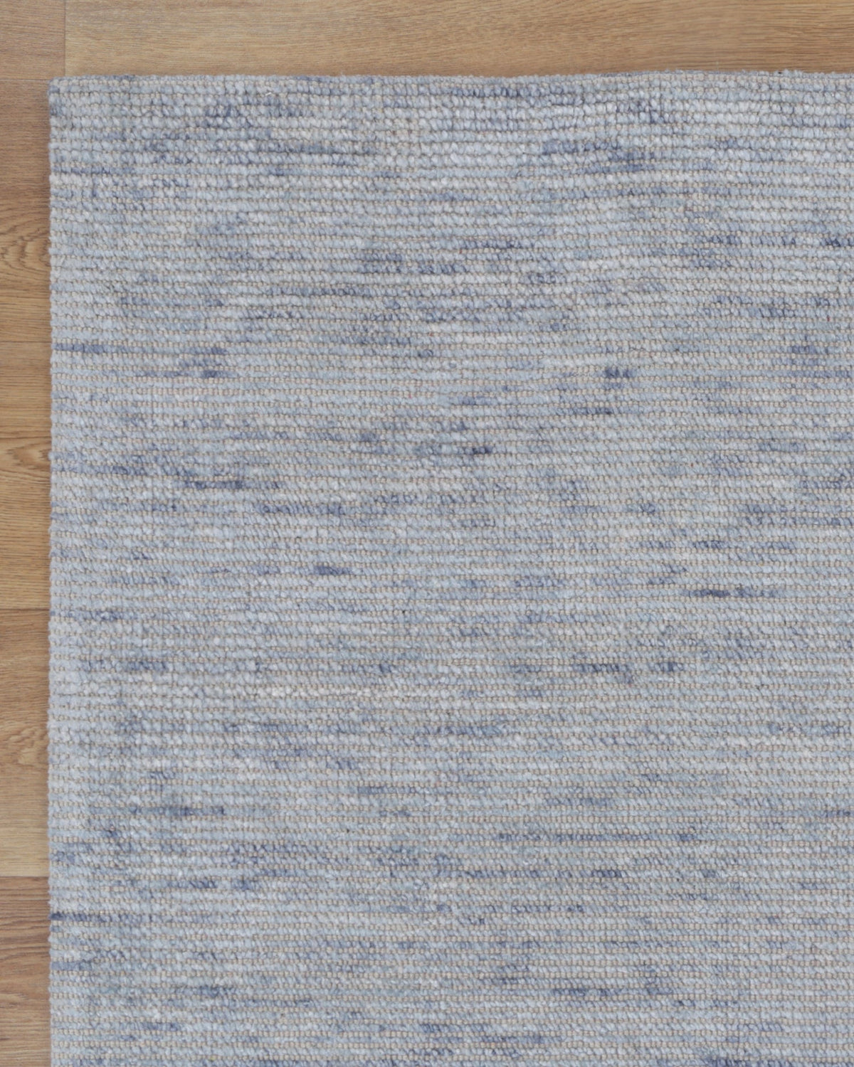 Casper Light Blue Rug on timber flooring