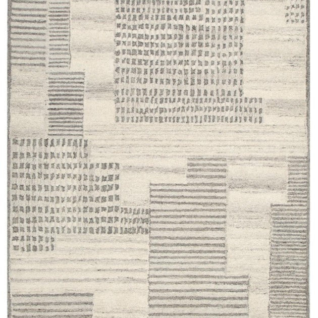 Patterned rug with geometric design on a plain background