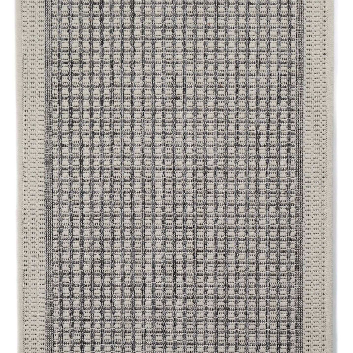 Rectangular gray mat with textured surface on a white background