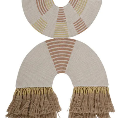 A pair of cream-colored woven baby footmuffs with fringe, featuring geometric patterns in tan, brown, and muted yellow.