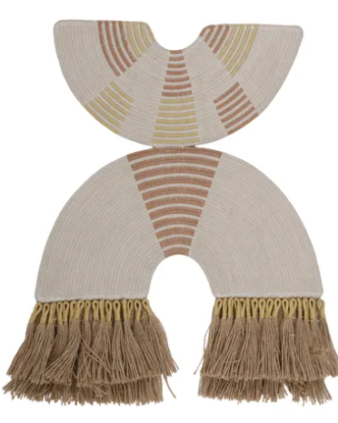 A pair of cream-colored woven baby footmuffs with fringe, featuring geometric patterns in tan, brown, and muted yellow.