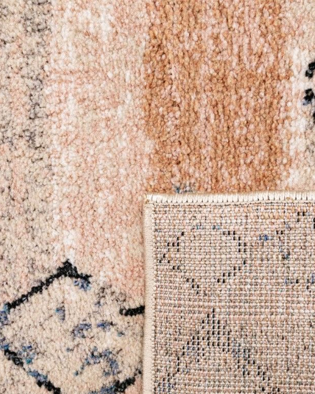 Close-up of a textured beige and brown rug with geometric pattern