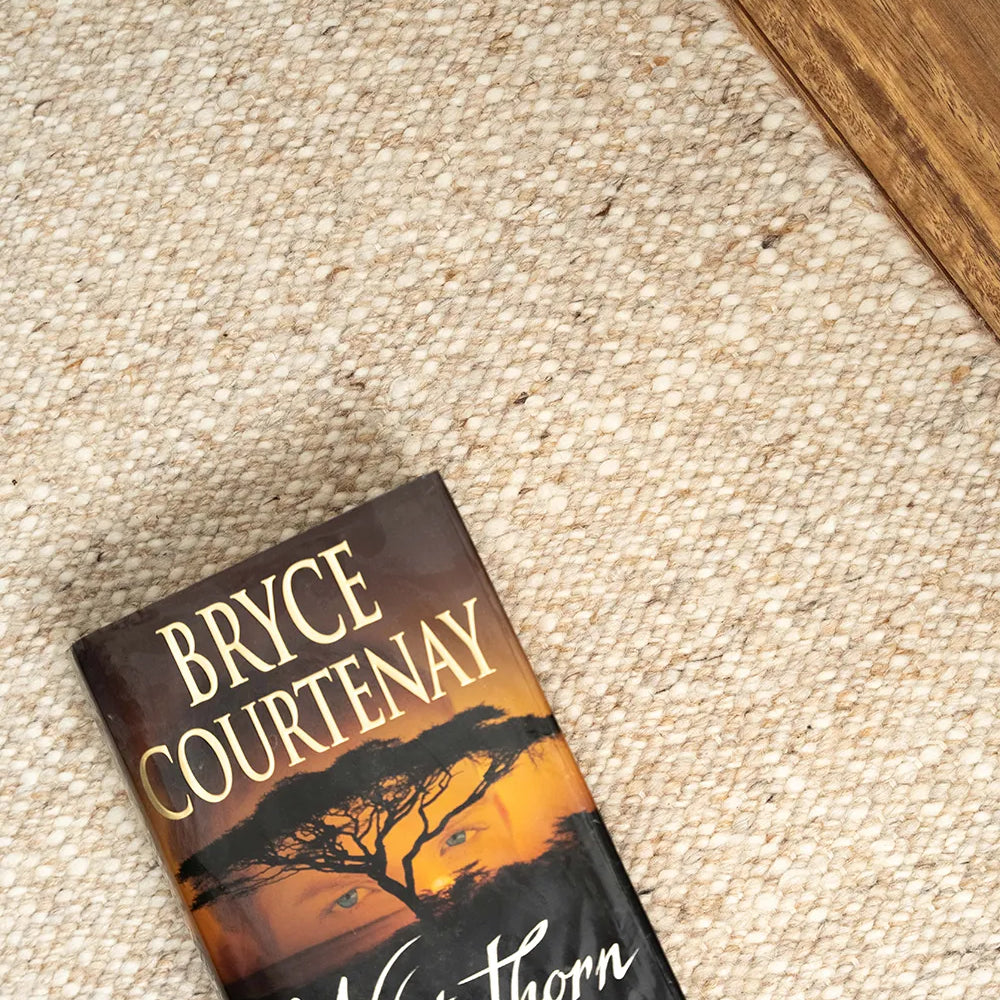 Wool rug with a book sitting on it
