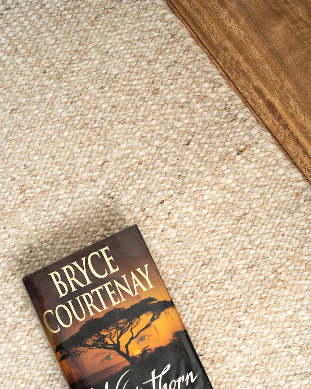 Wool rug with a book sitting on it
