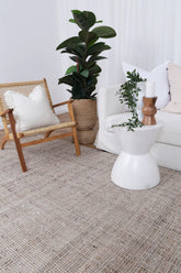 Dune Jute & Wool Rug placed in a coastal-themed room, emphasizing its compatibility with serene, beach-inspired decor.