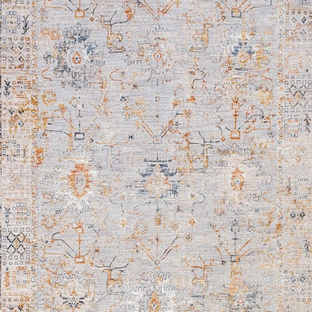 A distressed traditional area rug featuring a faded light gray base with intricate patterns in muted orange, beige, and soft blue.