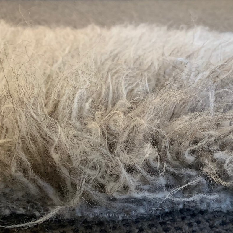 Close-up of textured fabric with a focus on fibers