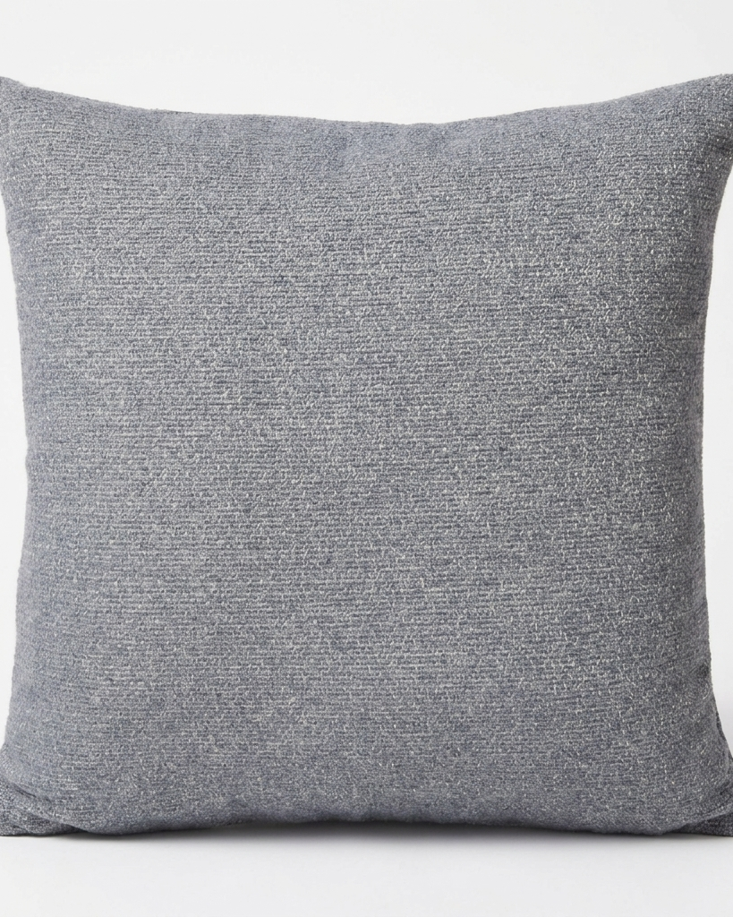 A square throw pillow in a textured gray woven fabric, shown against a plain white background.
