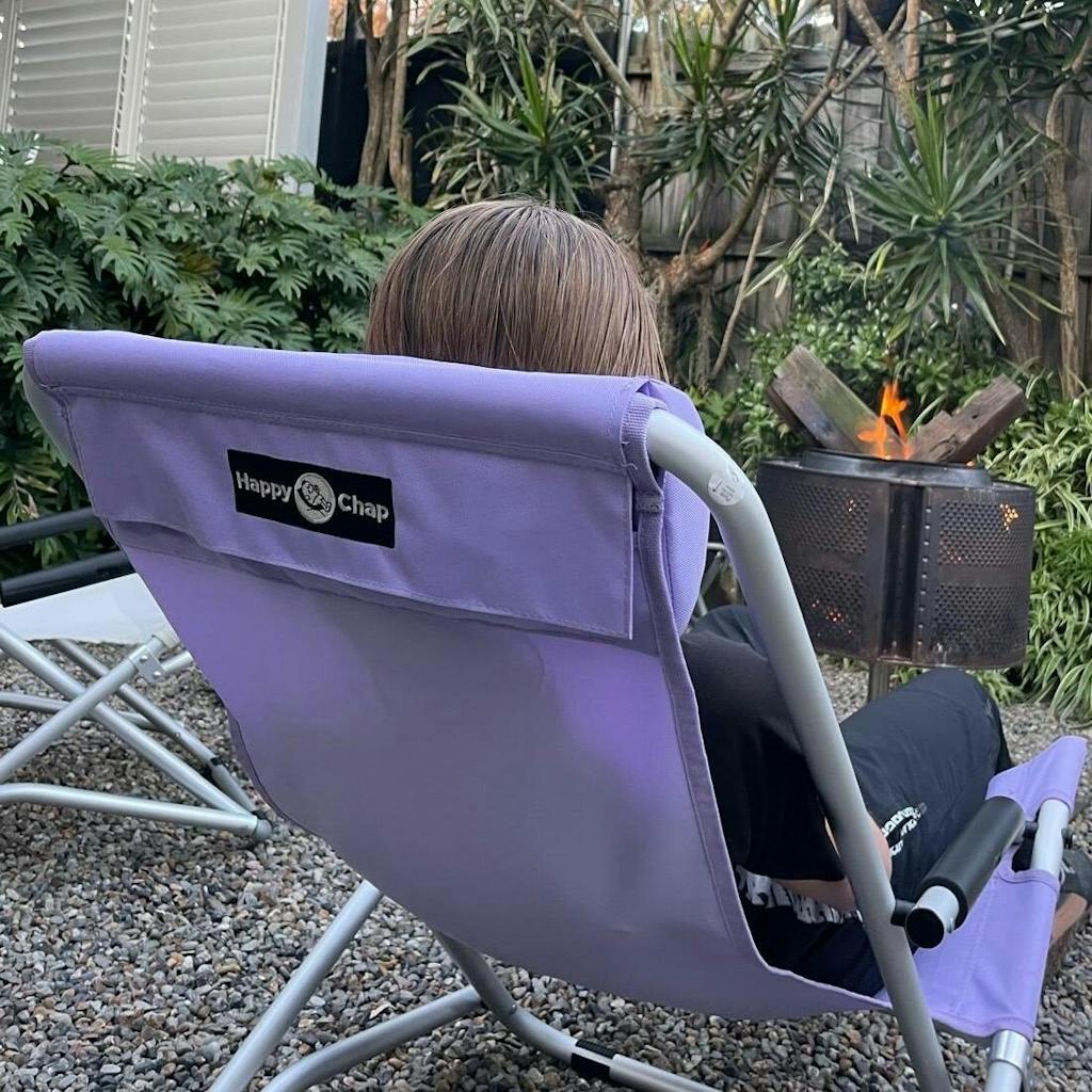 Happy Chap folding chair in front of a camp fire