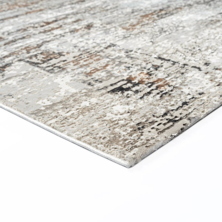 Textured area rug with a neutral color palette on a white background
