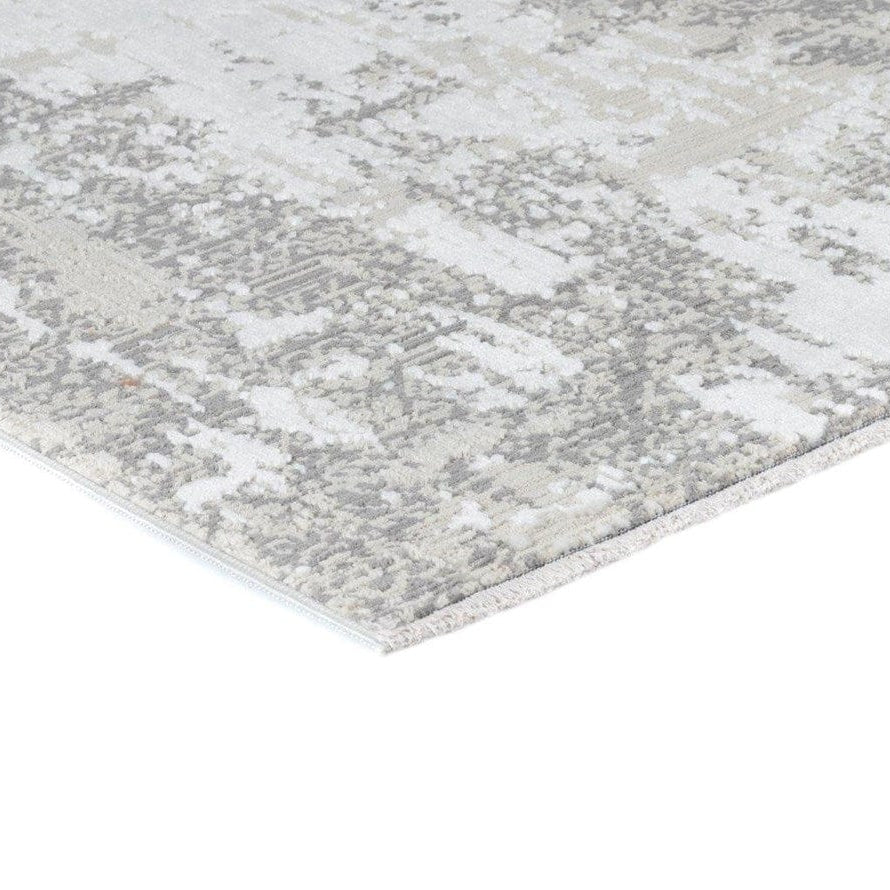 Gray and white patterned rug on a white background