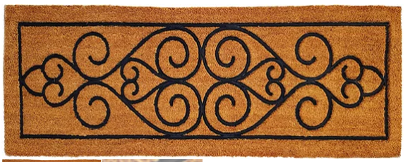 Decorative doormat with black scroll pattern on a brown background