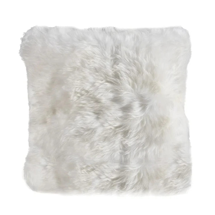 White sheepskin cushion pillow on a white background