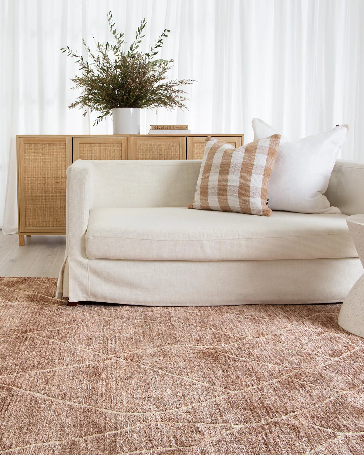 Kendra Rug elegantly placed in a room, demonstrating its adaptability and charm in a home environment.