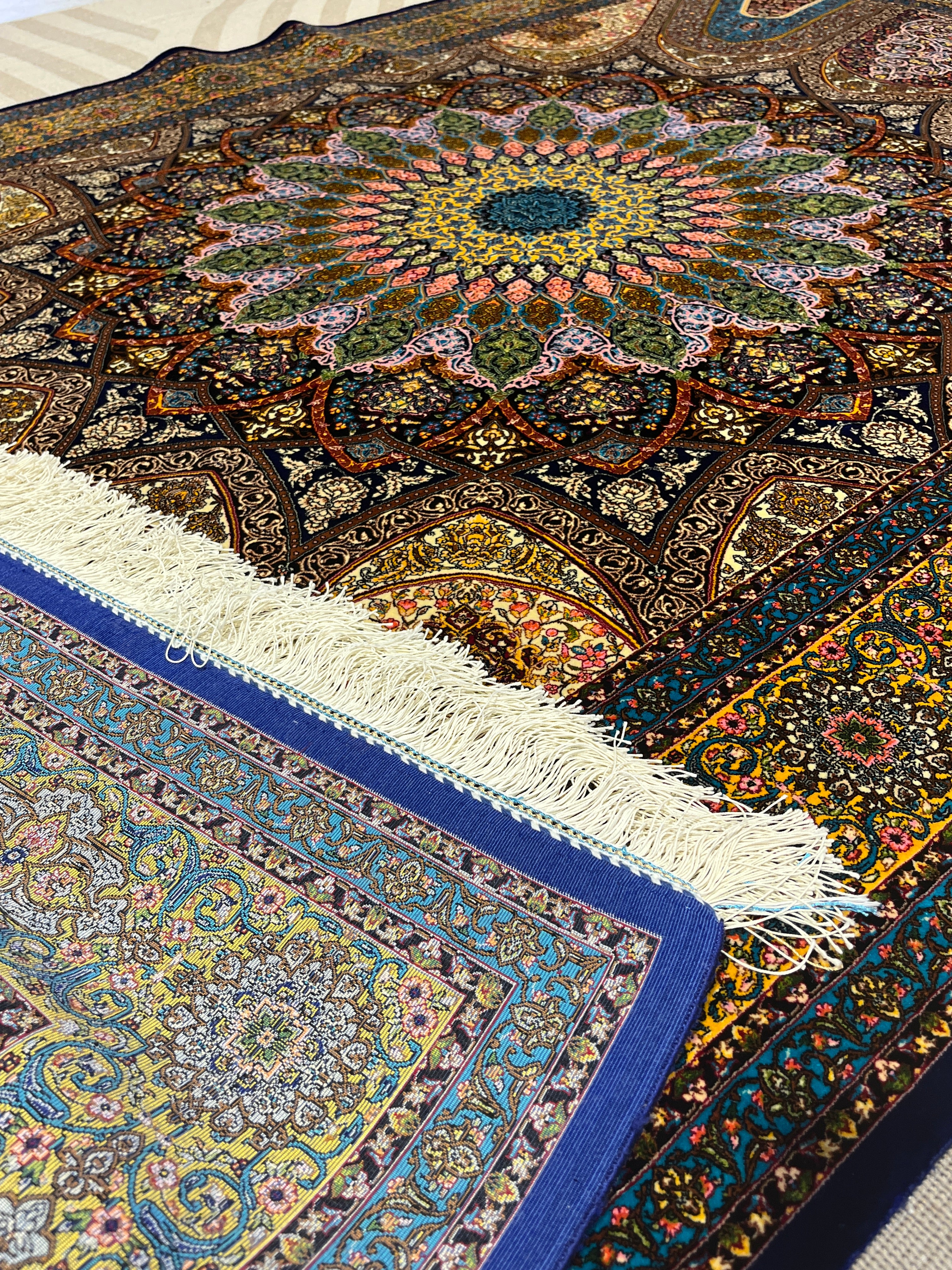 Close-up of intricately patterned rugs with vibrant colors.