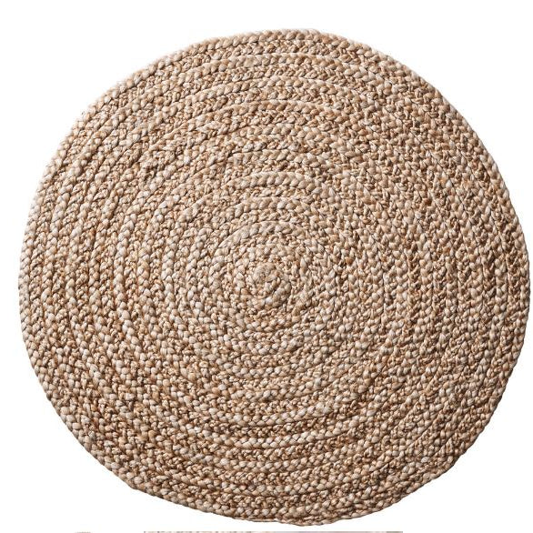 Round braided rug on a white background