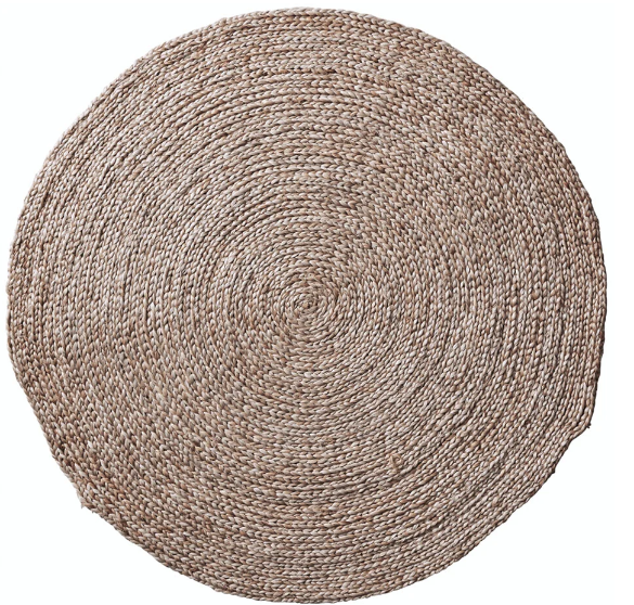 A round braided jute rug with a textured plain weave design in a natural brown color.