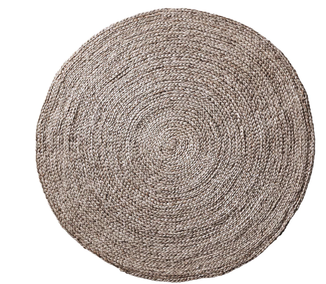 Round woven rug on a white background