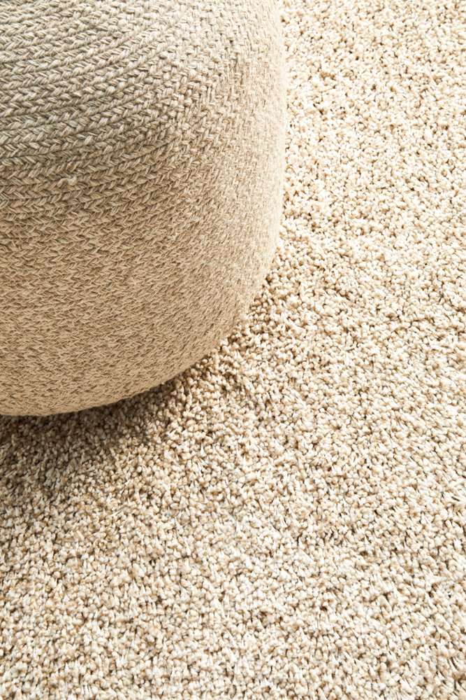 The Laguna Rug in Cream elegantly placed in a room, showing how its neutral tone and modern style enhance any living space.