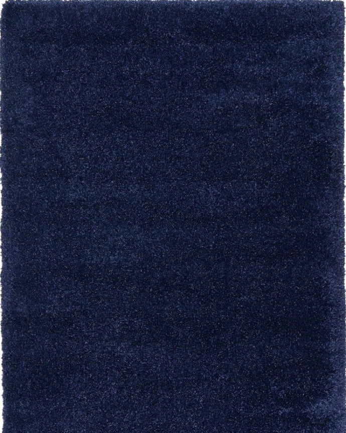 Entire image of the Laguna Rug in a rich Denim shade, showcasing its modern design and luxurious hand-tufted texture.