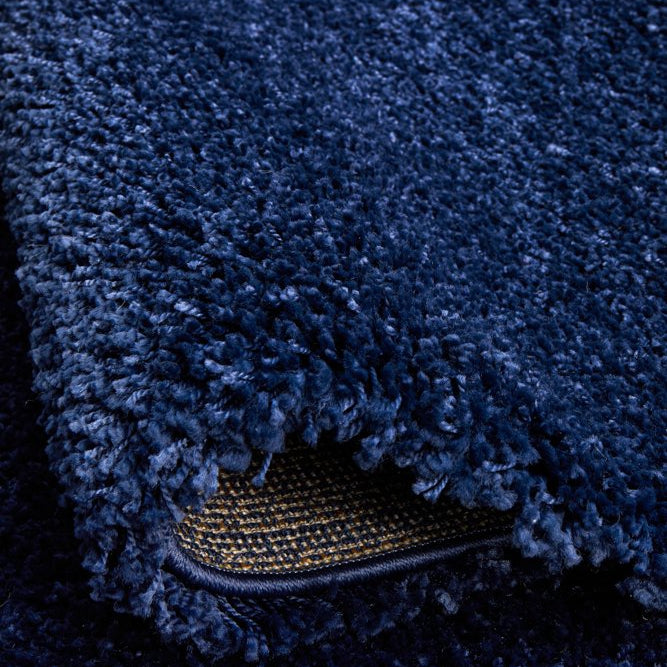 The Laguna Rug in Denim under natural lighting, accentuating the vibrant and warm tones of its denim colour.