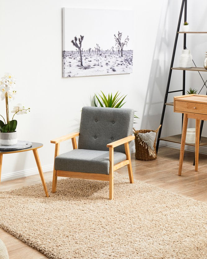 The Laguna Rug in Linen, elegantly placed in a room, showing its versatility and ability to enhance both modern and classic interiors.