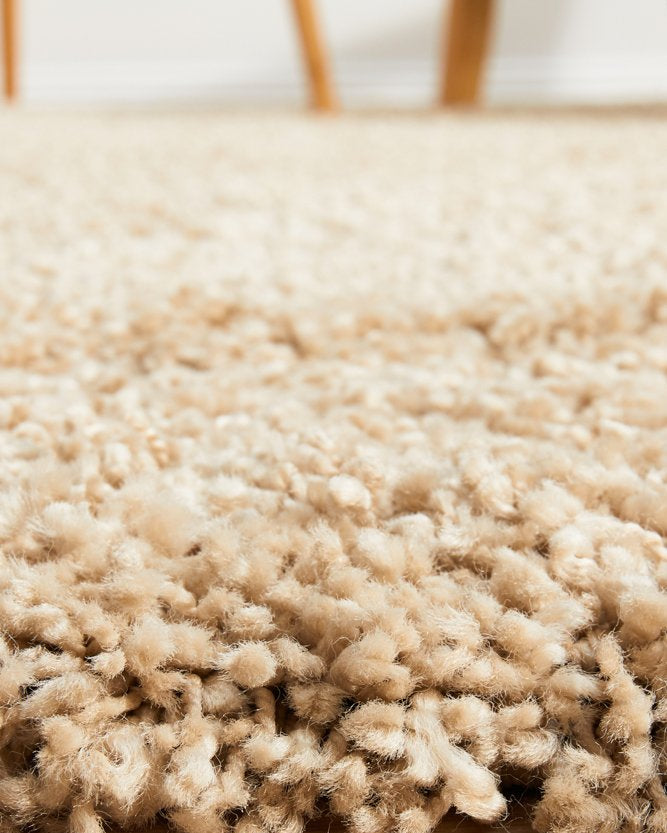 Zoomed-in view displaying the intricate texture and quality of the Laguna Rug in Linen.