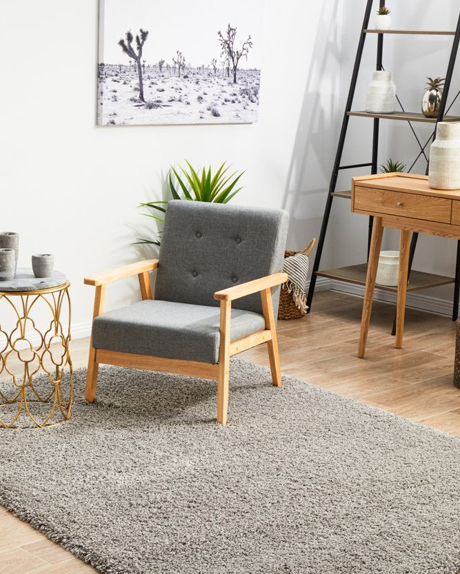 The Laguna Rug in Silver elegantly displayed in a modern room, accentuating its sleek and contemporary aesthetic.