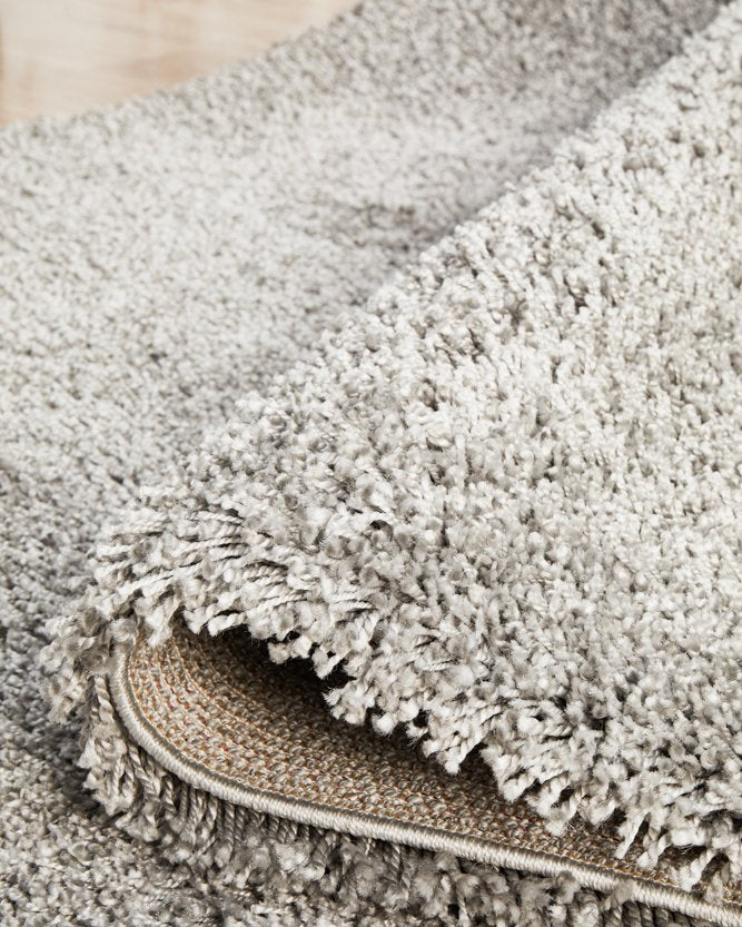 The Laguna Rug in Silver under natural lighting, enhancing the elegant silver hue and the luxurious feel of the rug.