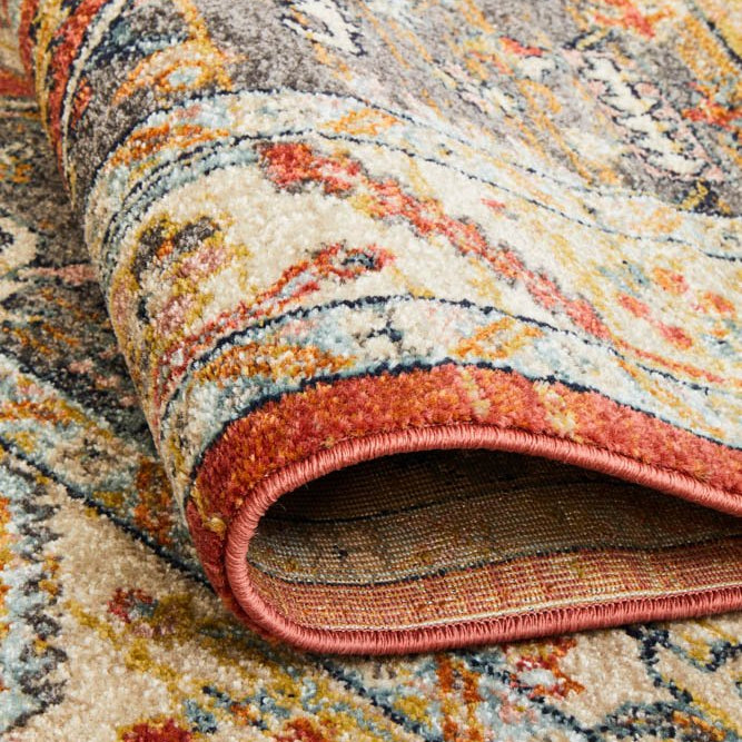 The Legacy Rug in Terracotta under natural light, enhancing the warmth and depth of its earthy tones.