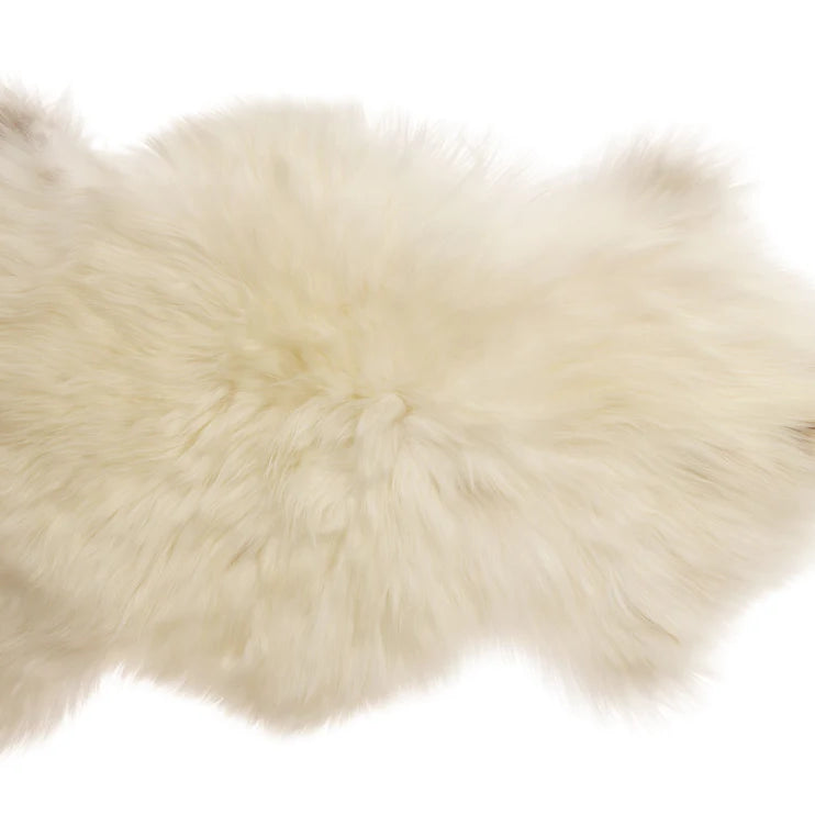 White fur rug on a white background