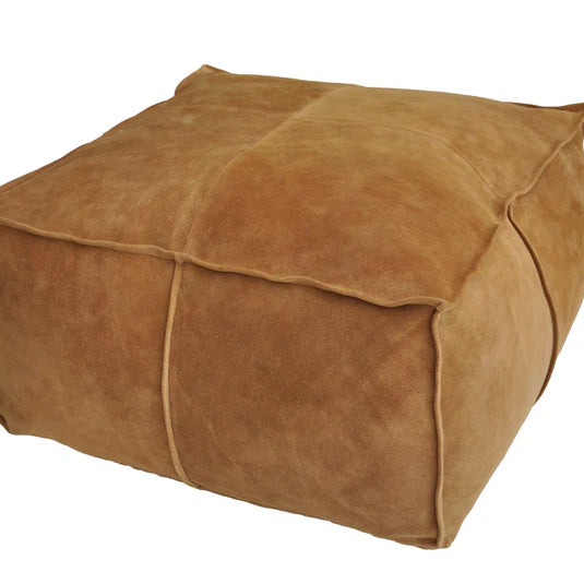 Brown suede ottoman on a white background