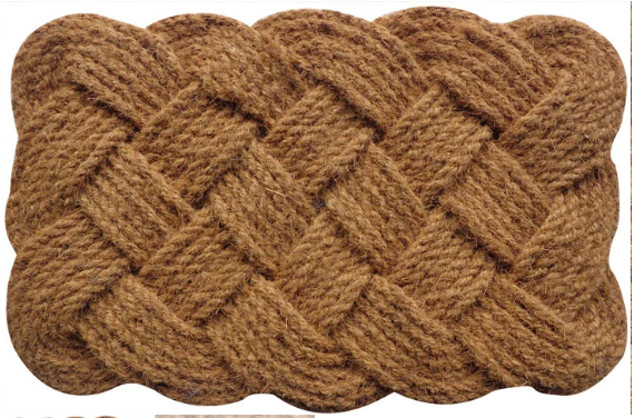Brown braided doormat on a white background