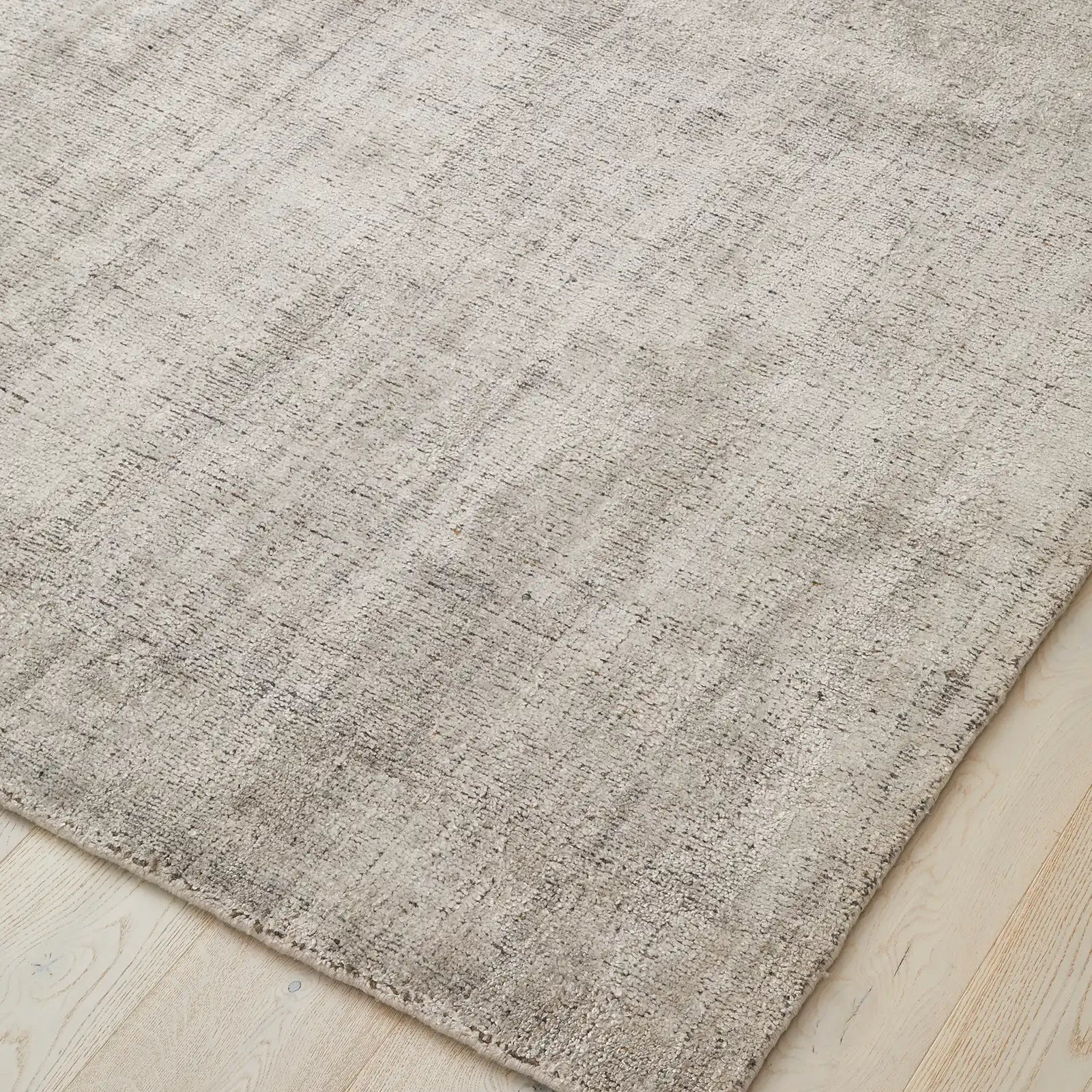 Close-up image highlighting the texture and weave of the rug, emphasising the blend of viscose and wool materials.