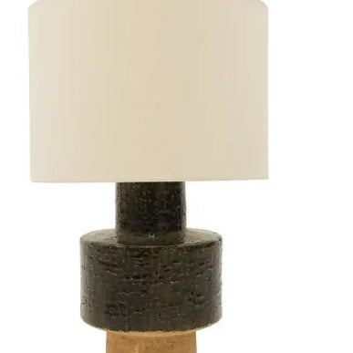 Table lamp with a textured brown base and beige lampshade on a white background