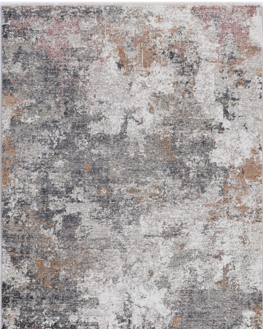 A modern rectangular rug with a contemporary geometric pattern in shades of gray, white, and subtle hints of other colors.