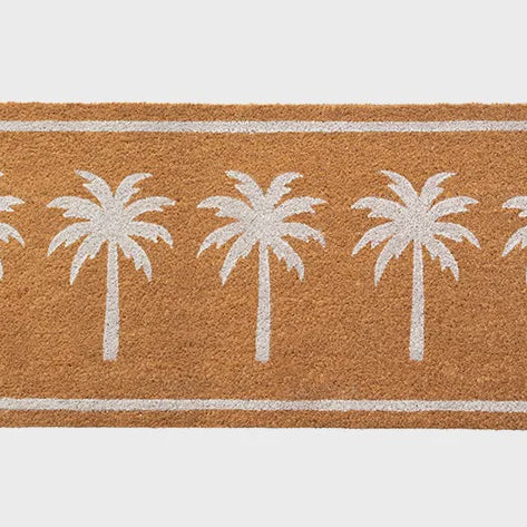 Doormat with white palm tree design on a brown background