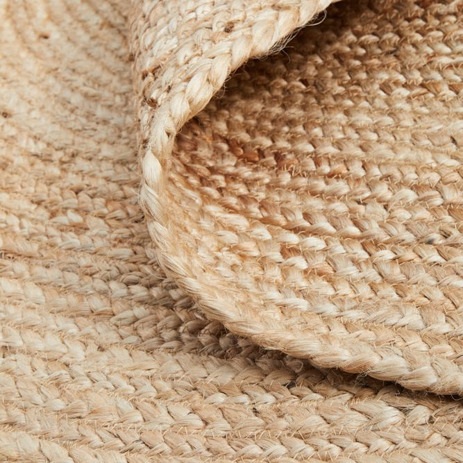 Close-up of a woven beige jute rug