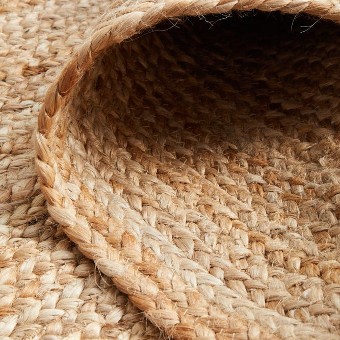 Close-up of a woven jute mat with natural fibers.