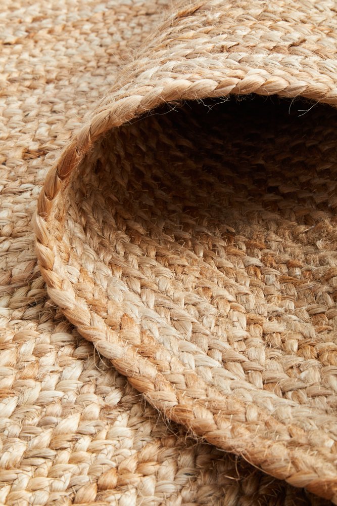 Close-up of a woven jute mat with natural fibers.