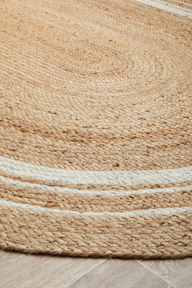 Close-up of a woven jute rug with natural brown and beige colors.
