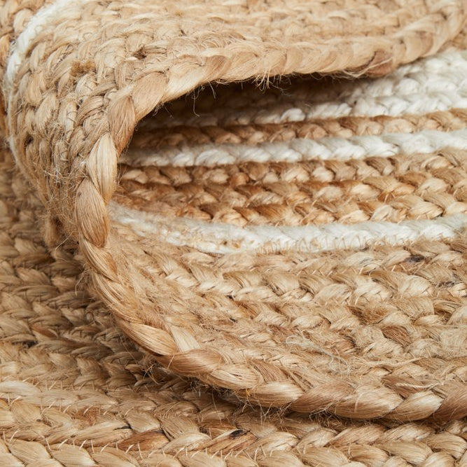 Close-up of woven jute rope with natural beige color.